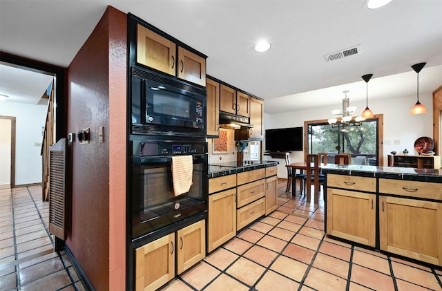 kitchen with black appliances, light tile patterned floors, hanging light fixtures, and an inviting chandelier