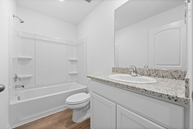 full bathroom with vanity,  shower combination, toilet, and wood-type flooring