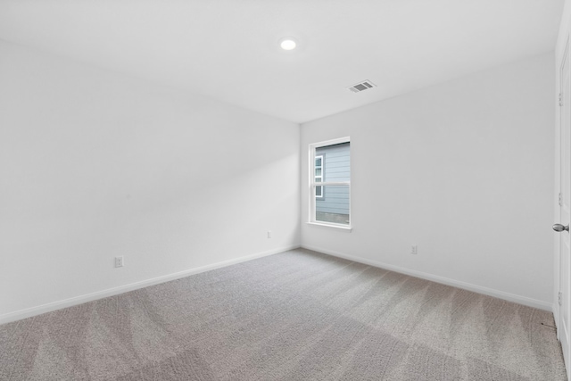 empty room with carpet flooring