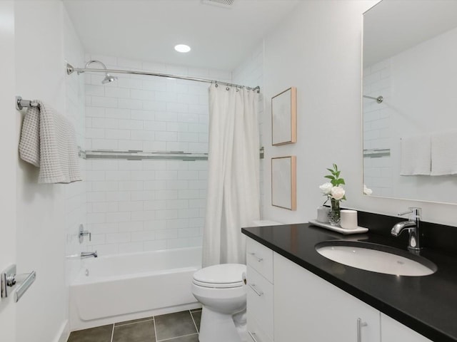 full bathroom with tile patterned flooring, shower / tub combo, vanity, and toilet