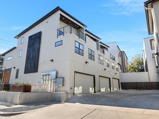 view of side of property with a garage