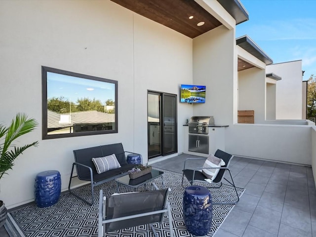 view of patio featuring a grill and an outdoor hangout area