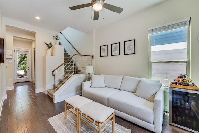 living room with dark hardwood / wood-style floors, wine cooler, and ceiling fan