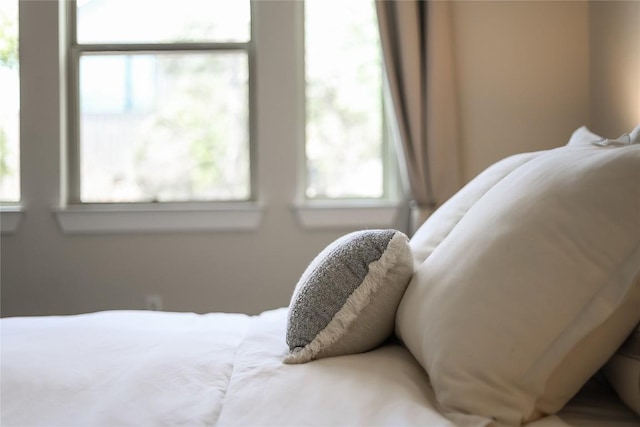 bedroom featuring multiple windows