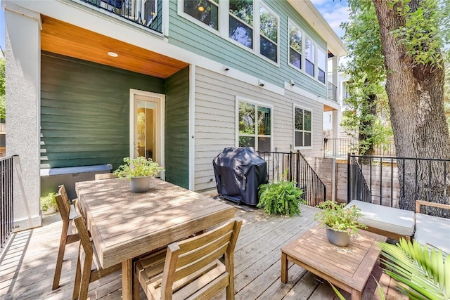 wooden deck with area for grilling