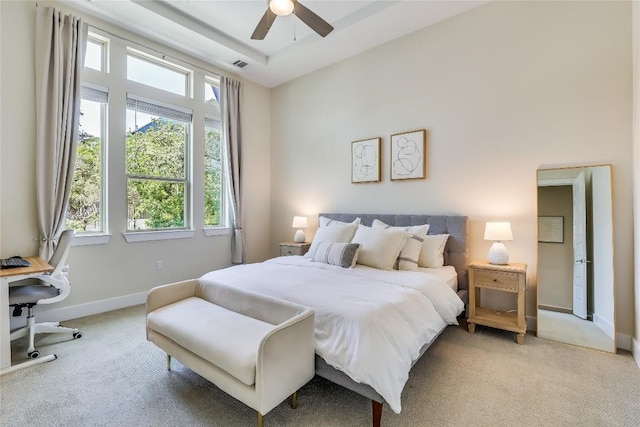 bedroom featuring light colored carpet and ceiling fan