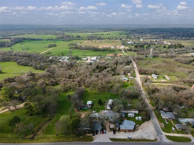 birds eye view of property with a rural view