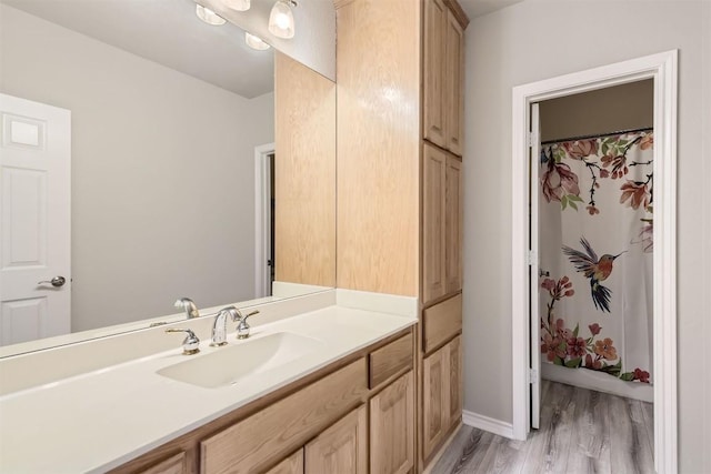 bathroom featuring vanity and hardwood / wood-style flooring