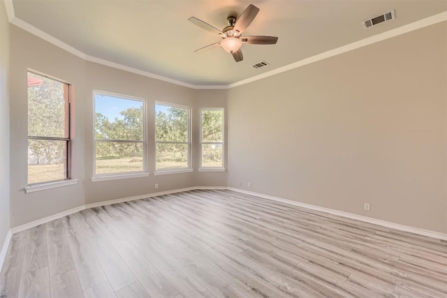 unfurnished room featuring ceiling fan, crown molding, and light hardwood / wood-style flooring