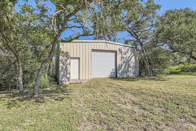 garage featuring a lawn