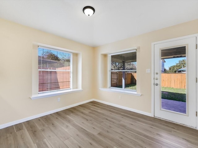 unfurnished dining area featuring light hardwood / wood-style flooring