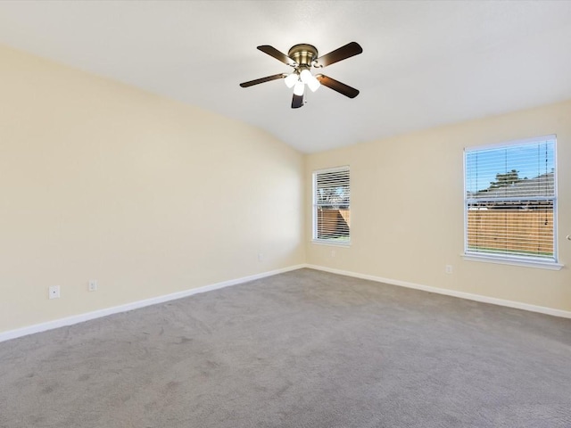 unfurnished room featuring carpet flooring, ceiling fan, and lofted ceiling