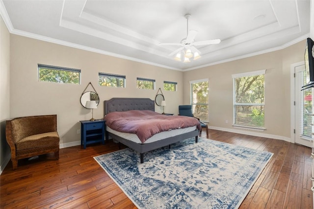 204 Woodland Park, Georgetown, TX 78633 - bedroom featuring a tray ceiling, wood-type flooring, crown molding, ceiling fan, and baseboards