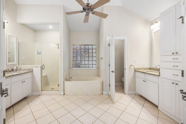 full bathroom featuring separate shower and tub, tile patterned flooring, vanity, and lofted ceiling