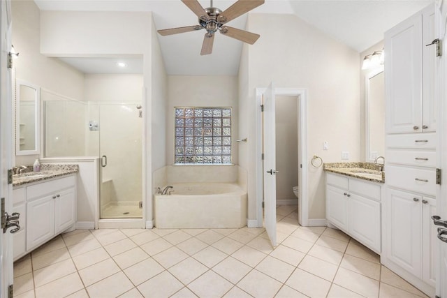 204 Woodland Park, Georgetown, TX 78633 - full bathroom featuring a bath, a shower stall, a ceiling fan, vanity, and vaulted ceiling