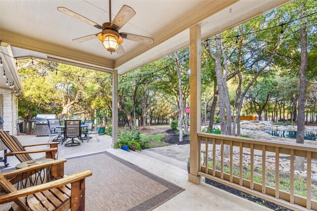 204 Woodland Park, Georgetown, TX 78633 - view of patio featuring outdoor dining space, a ceiling fan, a grill, and view of wooded area