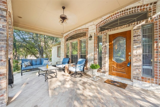204 Woodland Park, Georgetown, TX 78633 - doorway to property featuring outdoor lounge area, a porch, and brick siding