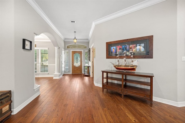 204 Woodland Park, Georgetown, TX 78633 - entrance foyer with ornate columns, arched walkways, hardwood / wood-style floors, and ornamental molding