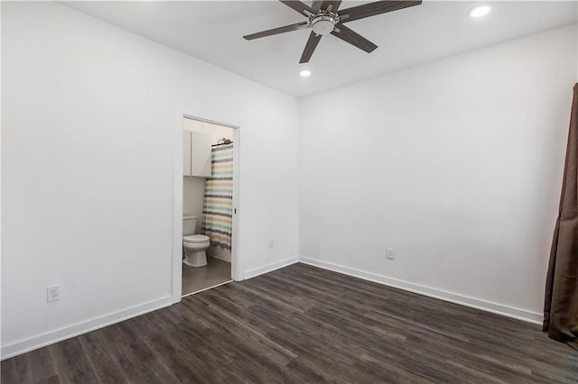 unfurnished bedroom with ensuite bathroom, ceiling fan, recessed lighting, baseboards, and dark wood finished floors