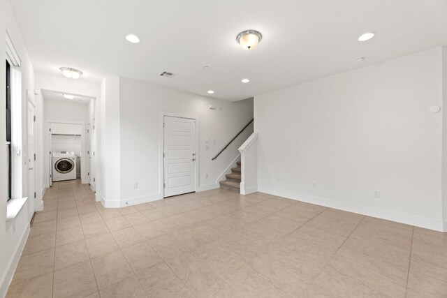 unfurnished room featuring washer / clothes dryer