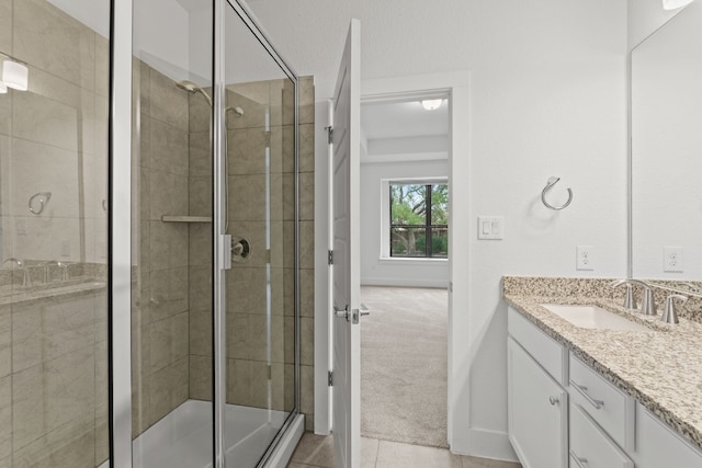 bathroom featuring vanity, tile patterned floors, and walk in shower