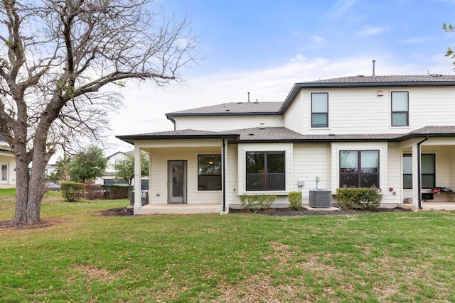 back of house featuring a yard, a patio, and cooling unit