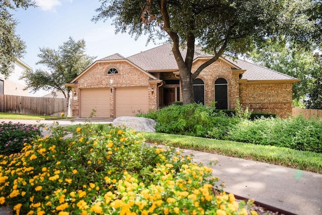 single story home featuring a garage