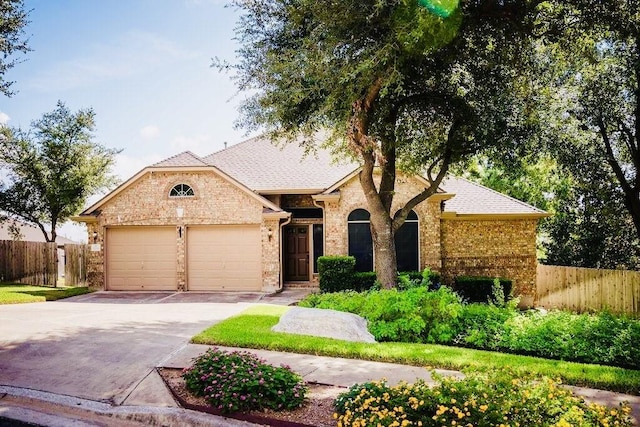 single story home with a garage