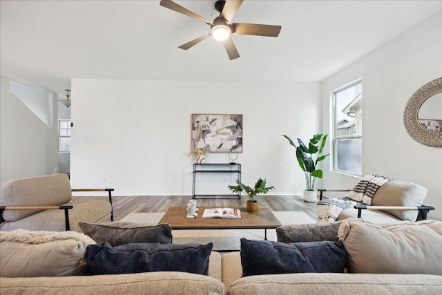 living room with ceiling fan and hardwood / wood-style flooring