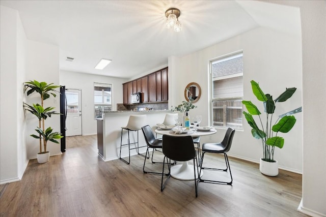 dining room with light hardwood / wood-style flooring