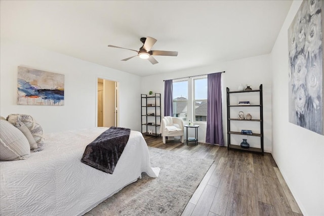 bedroom with ceiling fan and hardwood / wood-style floors