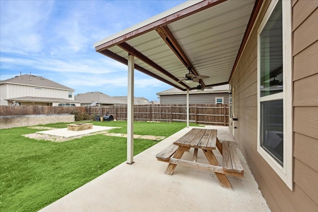 view of patio / terrace featuring ceiling fan and an outdoor fire pit