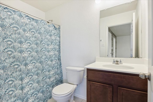 bathroom featuring walk in shower, vanity, and toilet