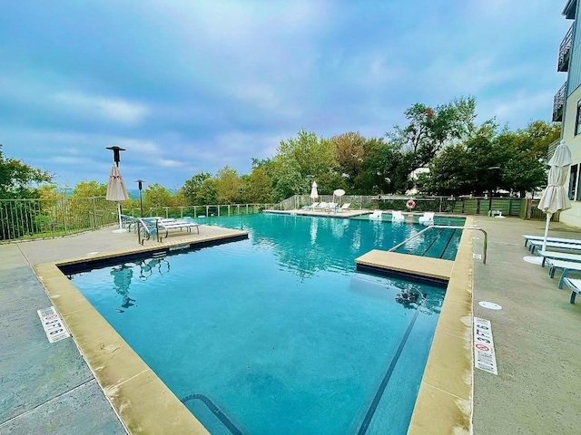 view of swimming pool with a patio area