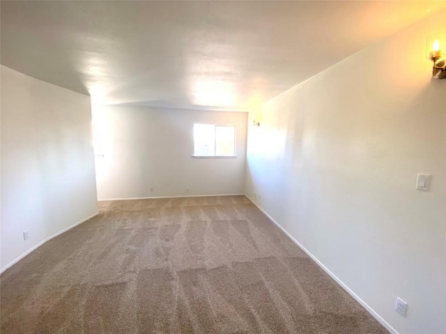 empty room featuring light carpet