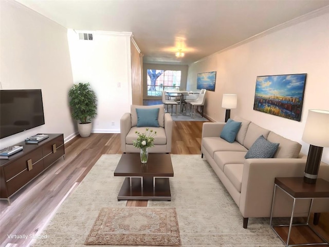 living room featuring crown molding and light wood-type flooring