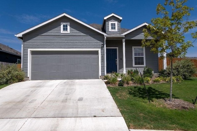 view of front of home with a garage and a front yard