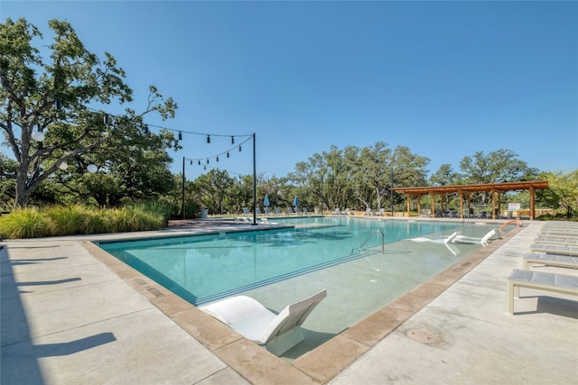 community pool featuring a pergola