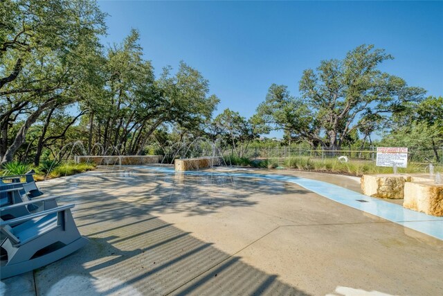 view of swimming pool with fence