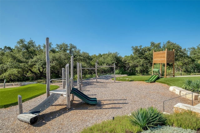 community play area featuring a lawn