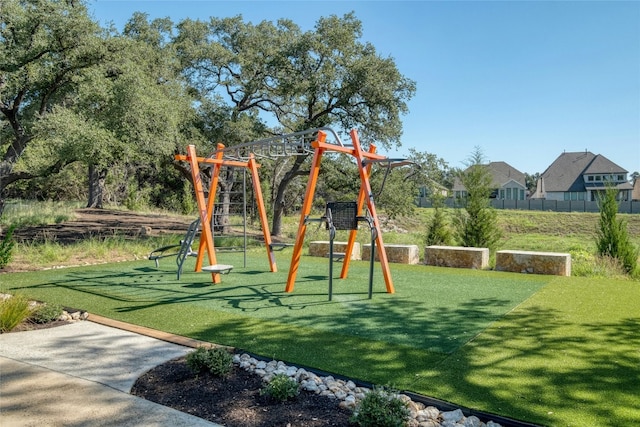 view of jungle gym with a lawn