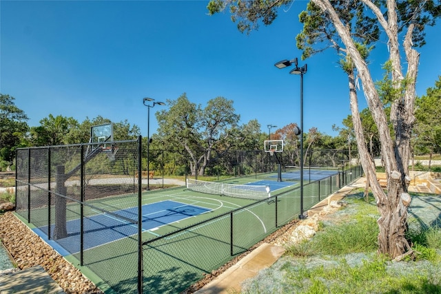 view of sport court with community basketball court and fence