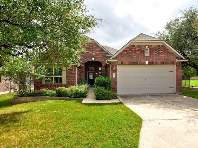 5021 Pyrenees Pass, Austin, TX 78738 - view of front of property featuring brick siding, an attached garage, and concrete driveway