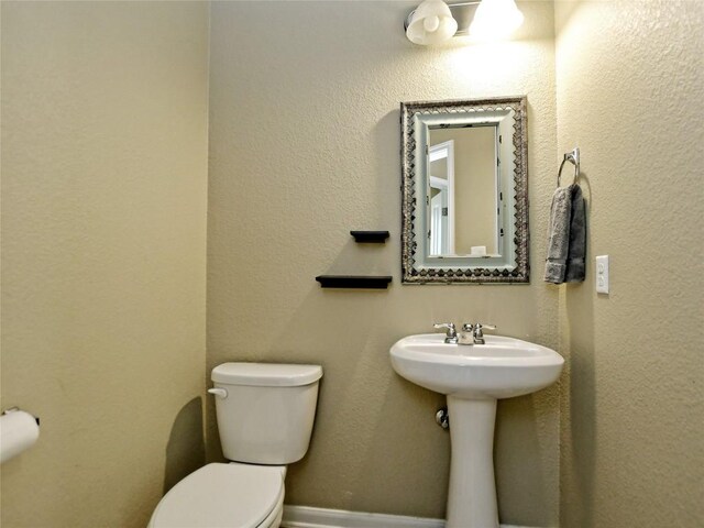 bathroom with toilet and sink