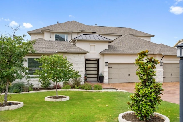 view of front facade featuring a garage and a front yard