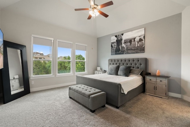 bedroom featuring light colored carpet, high vaulted ceiling, and ceiling fan