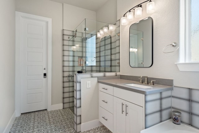 bathroom with vanity, tile patterned floors, and walk in shower