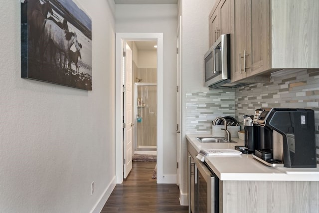 kitchen featuring light brown cabinets, sink, tasteful backsplash, dark hardwood / wood-style flooring, and beverage cooler