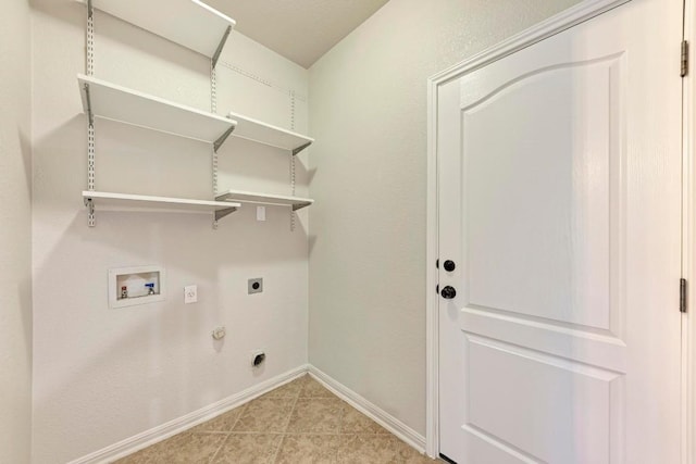 washroom with hookup for a washing machine, hookup for a gas dryer, light tile patterned floors, and electric dryer hookup