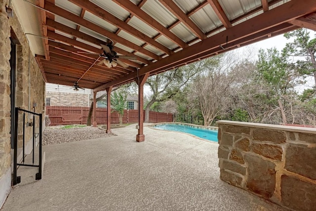 view of pool featuring ceiling fan and a patio